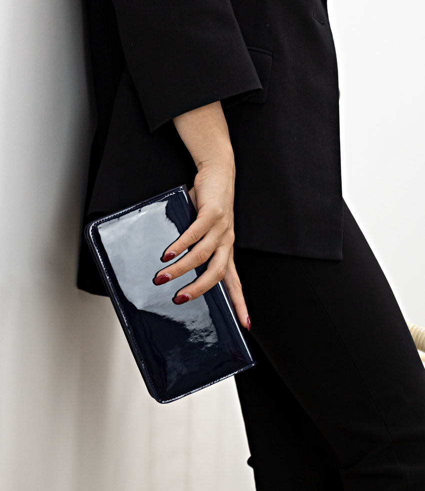 Orders black patent clutch